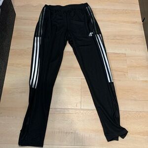 Adidas black joggers with grey reflective stripes